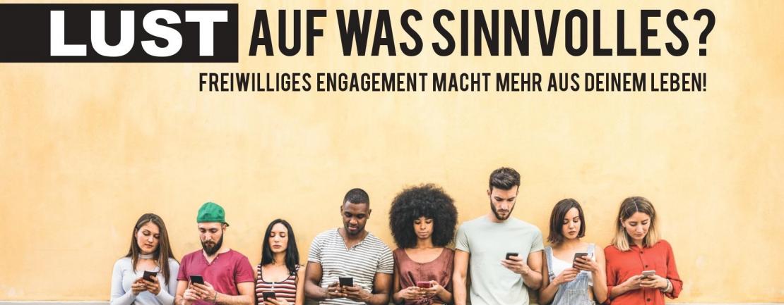 People staring at smartphones.